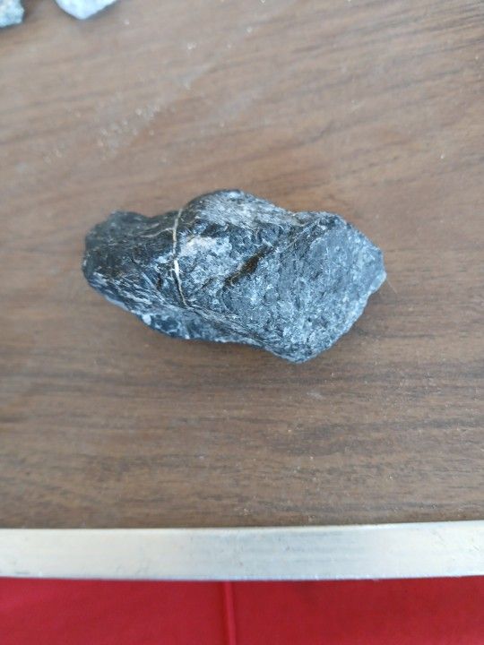 ONE BLACK AND WHITE ROCK, ONE THATS BROWN AND WHIT KINDA, A BLUE AND WHITE ROCK, Dark Blue Rock, And ALSO A PIKE OF BLACK ONES AS WELL,