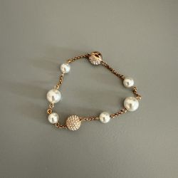 Swarovski women’s gold and pearl Bracelet