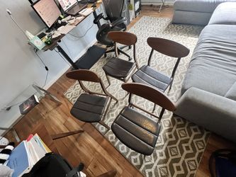Four Article Ecole leather dining chairs