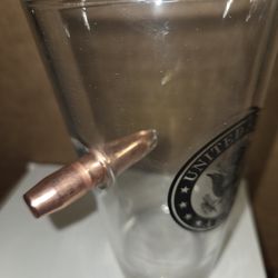 Drinking Glass. With Bullet Impeded In The Glass. 