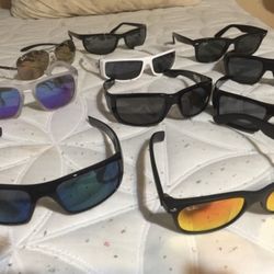 Variety of Oakley, Ray Ban, Spy Optics, and Von Zimmer sunglasses