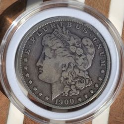 1900 O Morgan Silver Dollar in protective Capsule