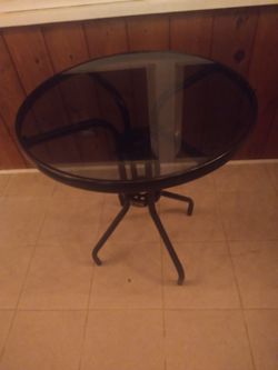 Glass top table used in Warrenville