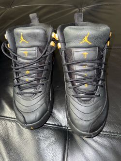 Air Jordan 12 Black and Gold Sneakers