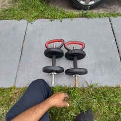 Dumbbells With Weights And A Set Of Push Up Handels.