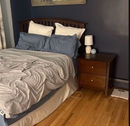 Headboard with boxspring and bedframe and nightstand