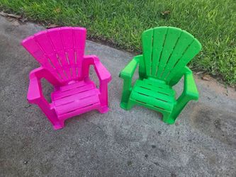 Two toddlers, kids, children's plastic Adirondack chairs