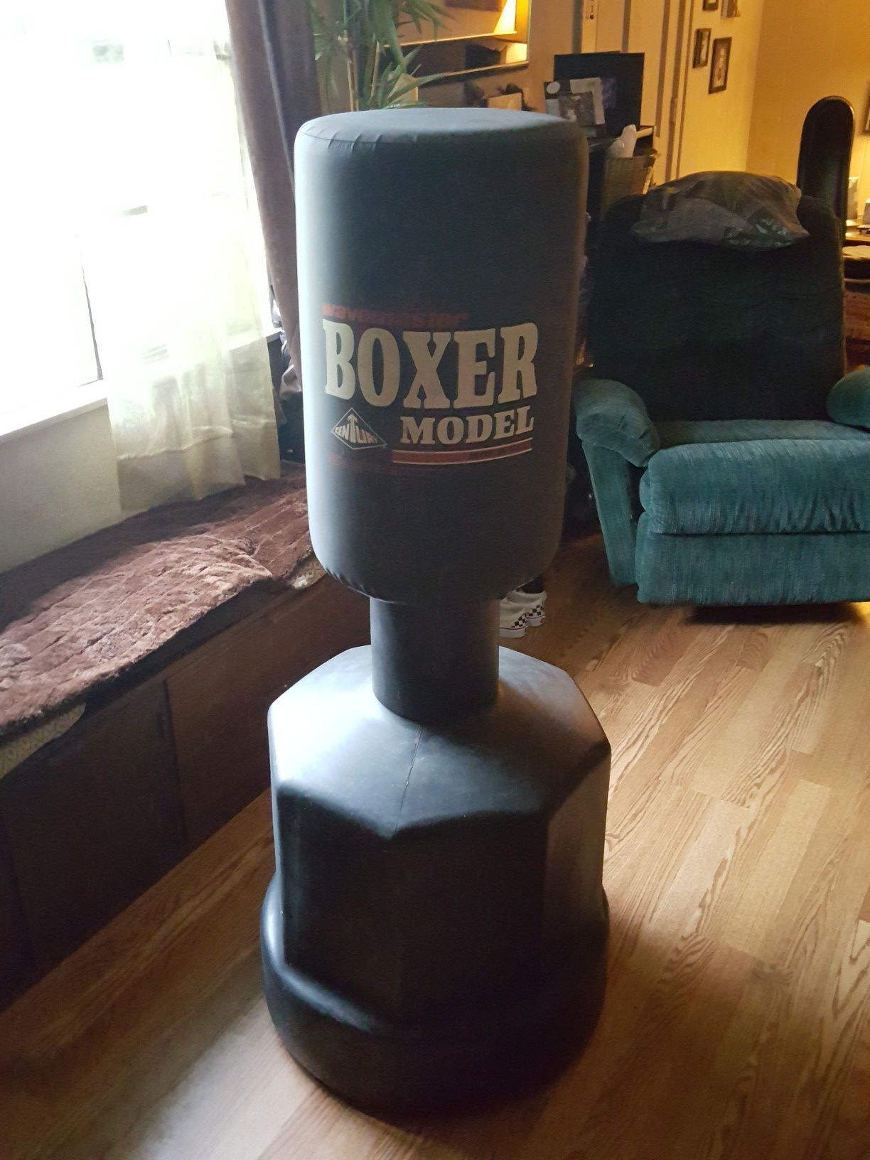 Wavemaster boxer standing punch bag, like new .Adjustable from leg, torso and head levels. Will accept $50 firm, originally $139.