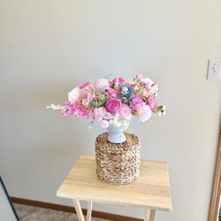 Pink romantic style bouquet with peonies and roses in a ceramic vase