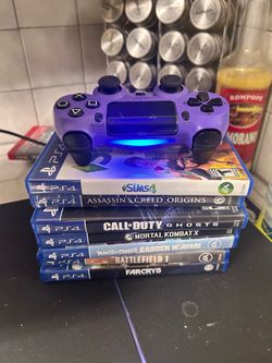 PS4 with 7 games cords and controller