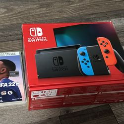 Nintendo Switch (Neon Blue/Red) - Great Condition. + FIFA 22 Console Serial XAW1000……
