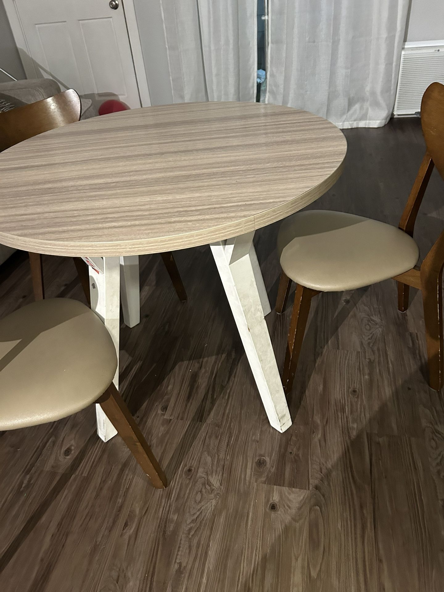 Dining Table Including Three Chairs
