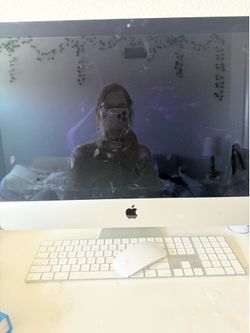 Apple desktop with keyboard and mouse