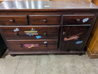 Dark Wood Chest of Drawers with Airplane Decor