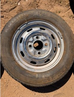 vw early 4 lug chrome rim w/tire (holds air)
