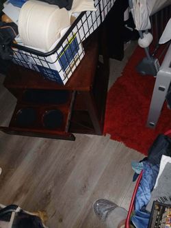 Brown woof side table  w pull out cup holder and magazine rack slides out at bottom
