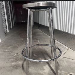 Two stainless steel matte brushed bar stools