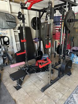 4 post rack / smith machine with cables. Bench included with accessories and 235lbs weight. $650