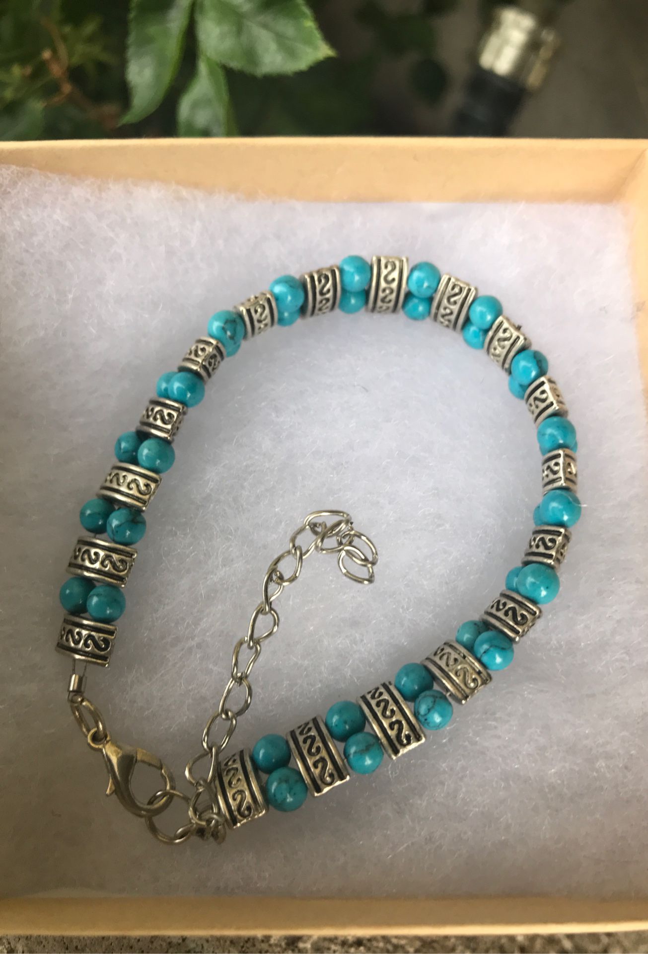 Turquoise with silver bracelet.