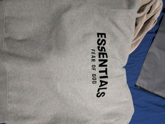 a size medium essentials hoodie