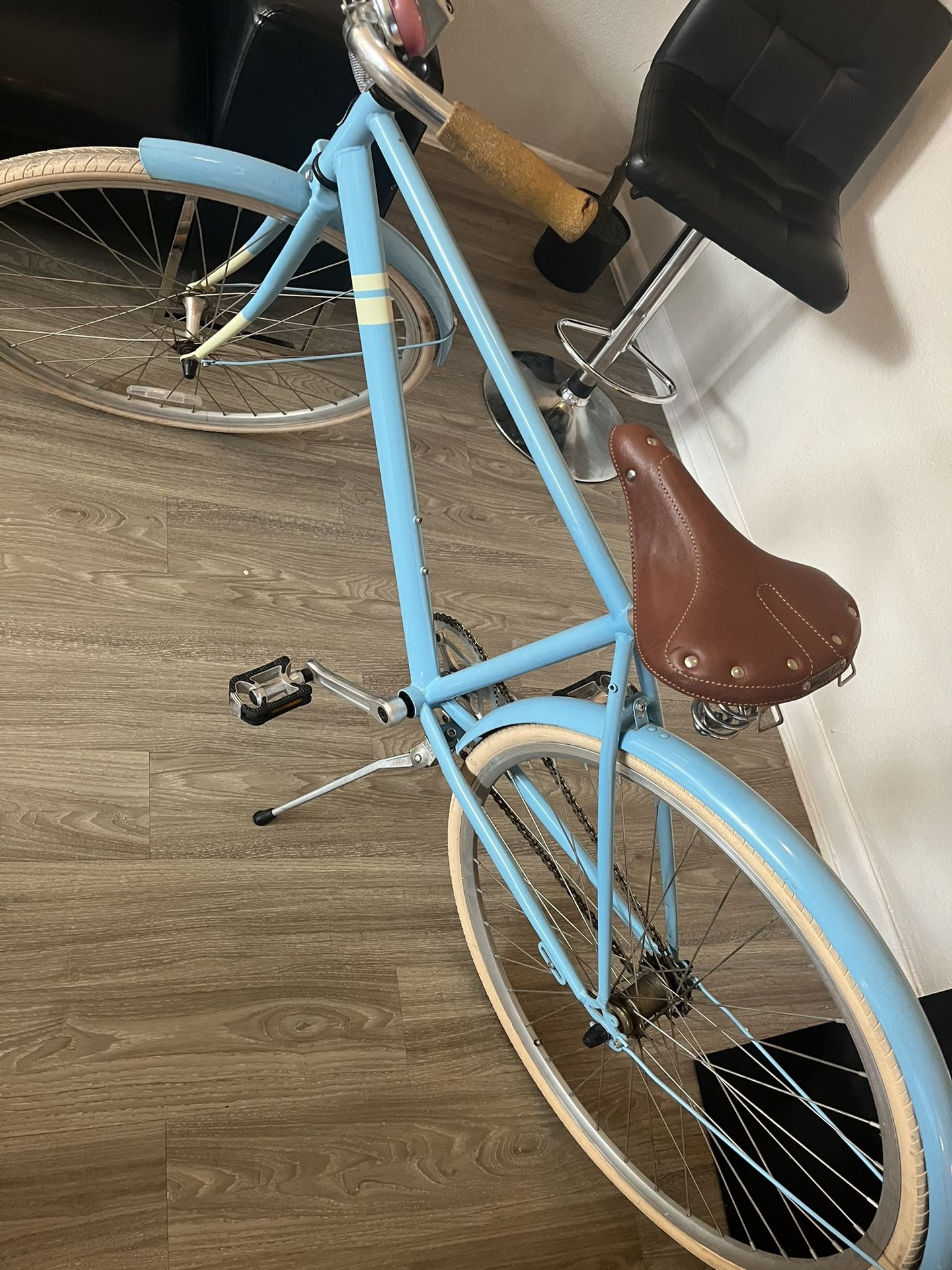 State Bicycle Co. City Bike, most likely the "Azure" model. It is a commuter-style bicycle designed with a classic aesthetic and modern features.