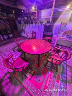 Early American round wooden dining table w/ four matching captain's chairs