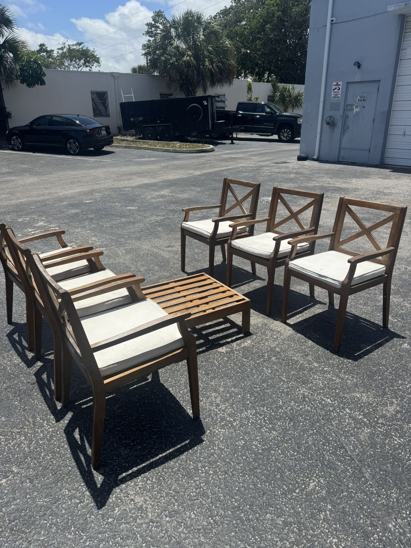 Peter Outdoor Acacia Wood Dining Chair, Set of 6 Chairs. Teak with Cream Cushions W/ Coffee Table - Retail: $2200.