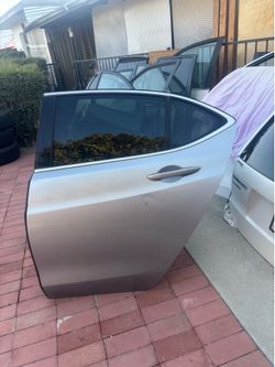 REAR DRIVER SIDE DOOR 2015-2020 ACURA TLX (SILVER COLOR) WITH HINGES.