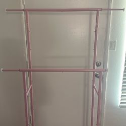 2 Pink Clothing Racks