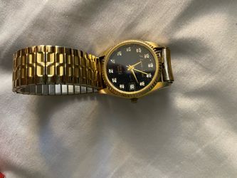I Love You" Swiss Quartz dress watch featuring a gold-toned fluted bezel and a classic presidential or jubilee-style link bracelet.