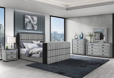 Luxurious, grey upholstered TV lift bed features crystal insert fireplace, speakers & more