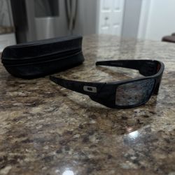 Oakley Gascan black camo sunglasses with blue Prizm Polorized lenses and semi hard leather case