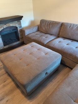 Costco's sectional w/ Storage Ottoman - Fireplace