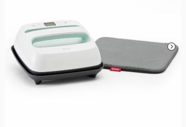 Cricut EasyPress 2 with Cricut Pressing Mat included.
