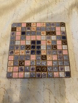 Vintage mcm 5 inch mosaic tile trivet , with metal back.