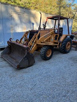 Case Utility Tractor with Front Loader Bucket