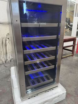Wine Cooler Size: 14.8X33.9X22.4 Inches. Packing Size: 20.2x38x26.6 Inches. Around 33 Bottles