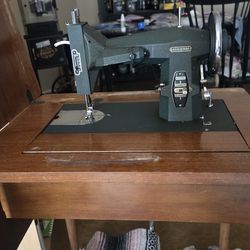 Vintage Kenmore sewing machine with cabinet