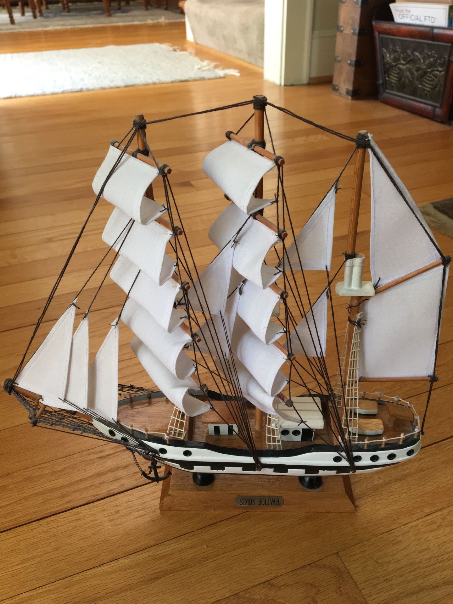 Simon Bolivar model wooden ship replica with cloth sails on stand.