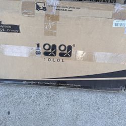 A replacement or windshield for a Club Car DS golf cart Aftermarket 