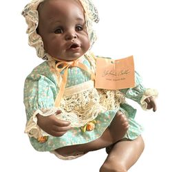 1991 Knowles Yolanda Bello Porcelain African American 8" seated Baby.  So Precious! Like new condition.  Please  look at all pictures and ask question