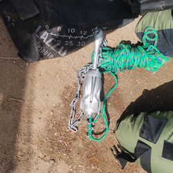 Inflatable fishing tube with anchor paddle waiters