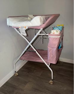 Girl collapsible baby diaper changing table
