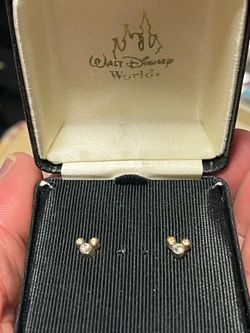 Mickey Mouse, silhouette post earrings. Still in original gift box, gold tone, and hypoallergenic.