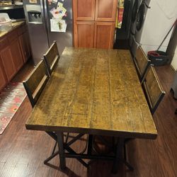 Dining Table and Chairs-Real Wood & Metal-I’m 15 minutes from the Outlet Mall in Canutillo-Dimensions are 5 feet x3 feet by 3 feet Tall-Thanks for Loo