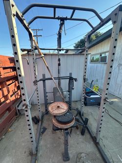 Reality fitness squat rack and bench with barbell