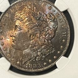 1883 O MORGAN TONED SILVER DOLLAR