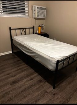 Moving sale  Twin Bed with mattress, side table like new