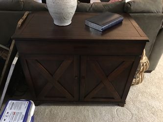 Solid wood table with drawers.