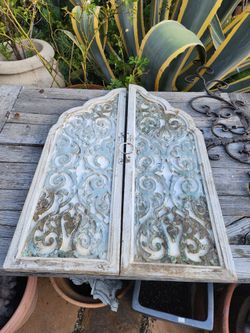 A Pair Of Hanging Decorative Doors